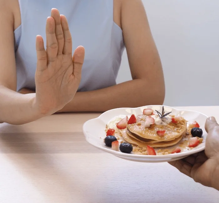 Person choosing a mindful portion, part of a daily MatchaTide routine